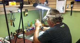 A view across the Gesswein's workbench, clocks and tools ranged along the shop