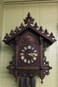 Restored small carved cuckoo clock